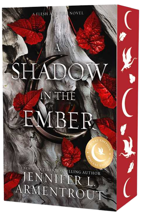 Book box for 'A Shadow in the Ember' by Jennifer L. Armentrout, featuring a dark gray and black cover with red leaves, a red spine with white moon phases and birds, and a gold Critics' Choice badge on embervale.ca